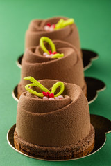 Mini mousse pastry dessert covered with chocolate velour