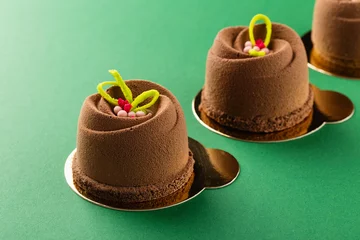 Rolgordijnen Mini mousse pastry dessert covered with chocolate velour © torriphoto