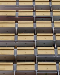 yellow balconies in a modern highrise apartment block or holiday apartments