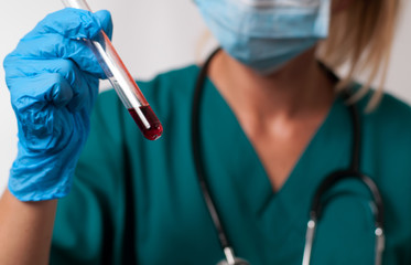 Female doctor doing the blood test