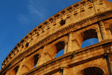 Detail of Colosseum on a blue sky in the sunset light 