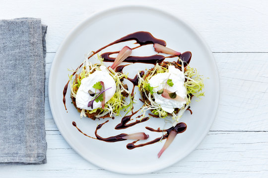 Crispy Duck Confit Hash frisee salad with poached egg