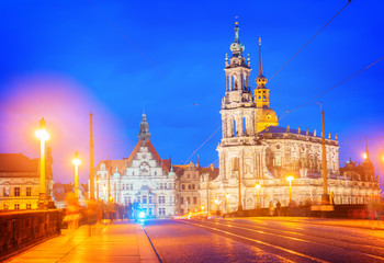Fototapeta na wymiar Augustus Bridge and Downtown of Dresden illuminated at night, Germany, retro toned