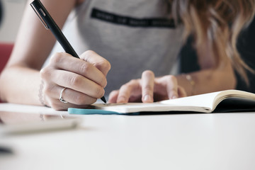 Woman writing at desk