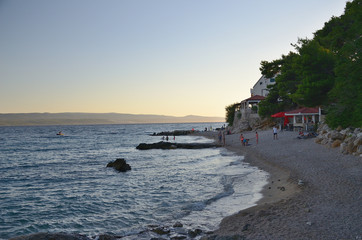 Croatina beach in Pisak village, croatian coast near Makarska with Brac island on the background