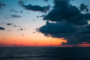 Sunset seascape with dramatic sky and colorful clouds