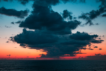 Fototapeta na wymiar Sunset seascape with dramatic sky and colorful clouds