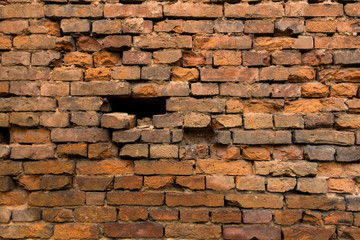 Red old brick wall, destroyed
