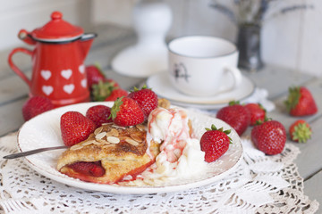 Sweet homemade pastries for breakfast. With strawberry filling and ice cream. Morning coffee. Red jug with milk. milkman. A cup of tea. family breakfast. Photo in white colors.