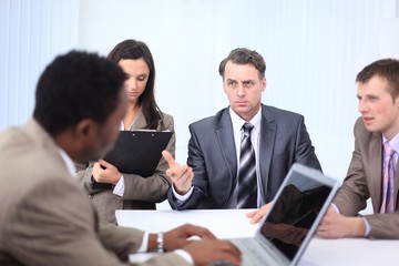 businessman holds working meeting with employees