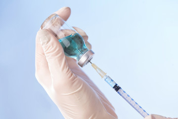 Hands with vaccine bottle 