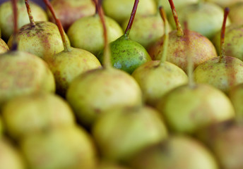Fresh ripe organic pears on rustic wooden table in geometric order, natural background 