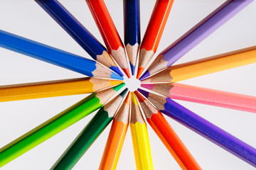 Fototapeta premium Color pencils on white background. Free space for text. Tools for drawing, education, school, creativity.