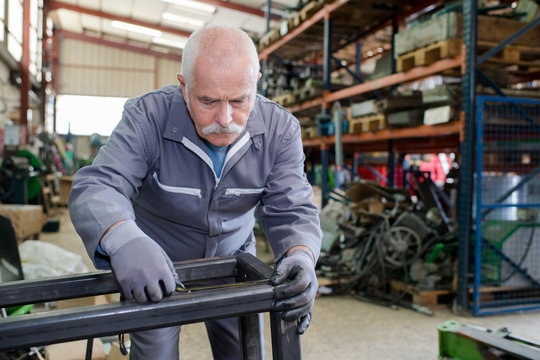 older male steel worker