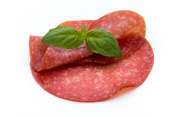 Salami slices isolated on white background.