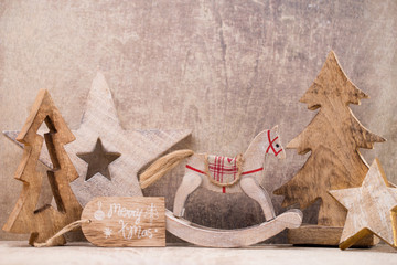 Christmas tree decorations on a wooden background. With bokeh ornaments.