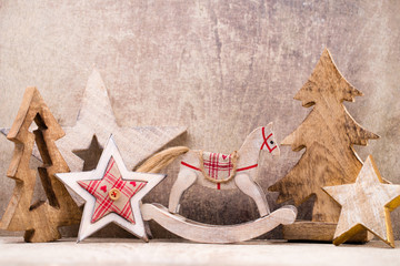 Christmas tree decorations on a wooden background. With bokeh ornaments.