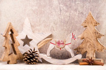 Christmas tree decorations on a wooden background. With bokeh ornaments.