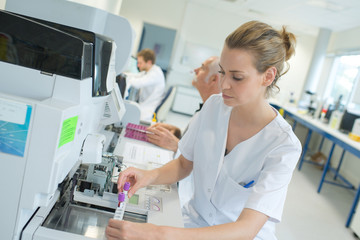 Fototapeta premium female scientist is testing new machine