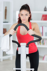healthy young woman exercising at home