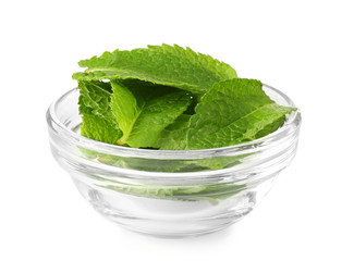 Glass bowl with fresh mint leaves on white background