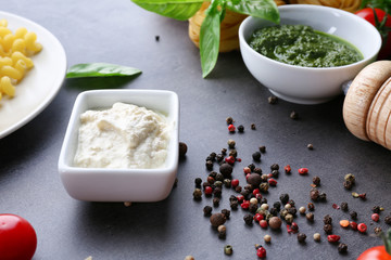 Bowl with delicious white sauce for pasta on table