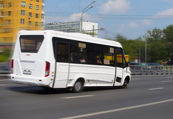 Fototapeta na wymiar minibus goes on the city street