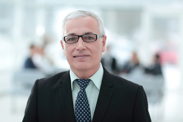 Naklejka premium close up portrait of senior businessman in office
