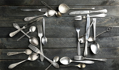 Composition with silverware on wooden background