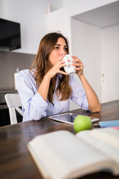Student at home having a coffee