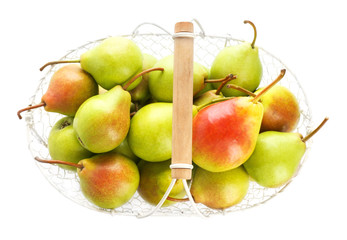 Basket with delicious ripe pears on white background