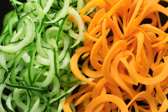 Raw cucumber and carrot spaghetti, close up