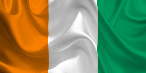 Waving flag of the Côte d'Ivoire. Ivory Coast Flag in the Wind. Ivory Coast National mark. Waving Côte d'Ivoire Flag. Ivory Coast Flag Flowing. © Miroslav