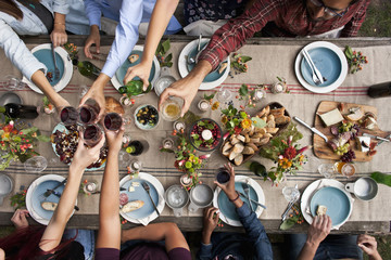 Friends Toasting at Dinner Party