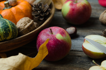 Obraz na płótnie Canvas Autumn still life with pumpkins, apples and nuts