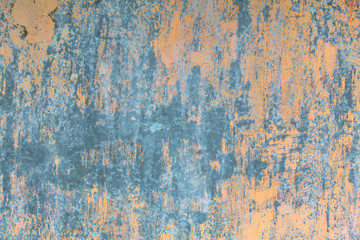 Texture rusty metal wall with peeling paint.
