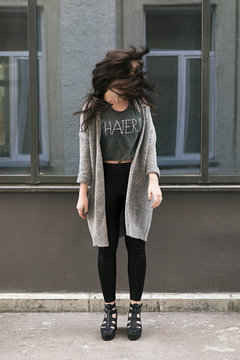 Young brunette with windy hair in motion