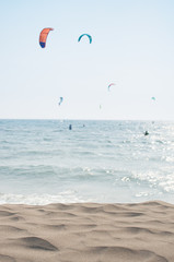 kitesurfing scene with beach sand in front