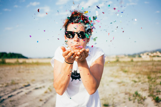 Woman Blowing Confetti