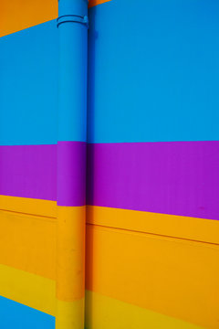 Blue Purple Yellow Orange at horizontal strip of wall background