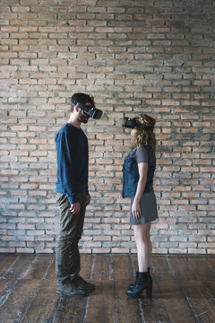 Couple at home using VR Reality viewer