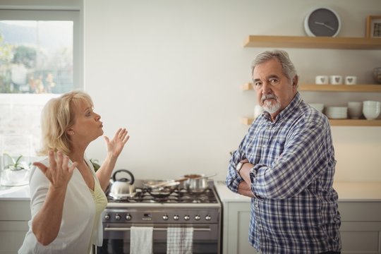 Senior couple arguing in kitchen - Powered by Adobe