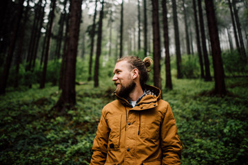 Portrait of man smiling in the forest
