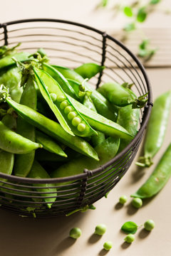 Green peas  in a metal basket