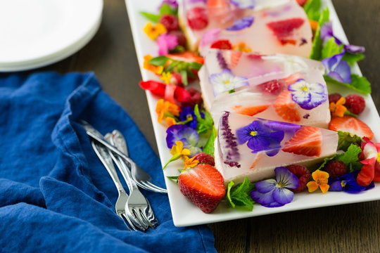 Horizontal shot of edible flower jelly slice dessert