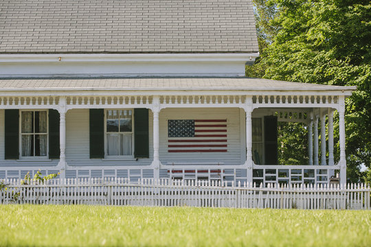 Cape Cod House with American Flag