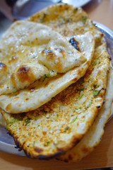 Many homemade small tortillas for breakfast, in silver foil, Jaipur city in India