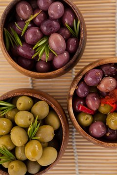 Directly above shot of olives in wooden bowls
