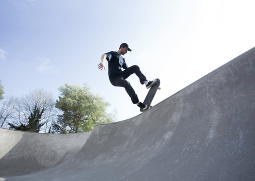 Skateboarder practising skills.