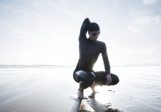 Triathlete on beach after swim